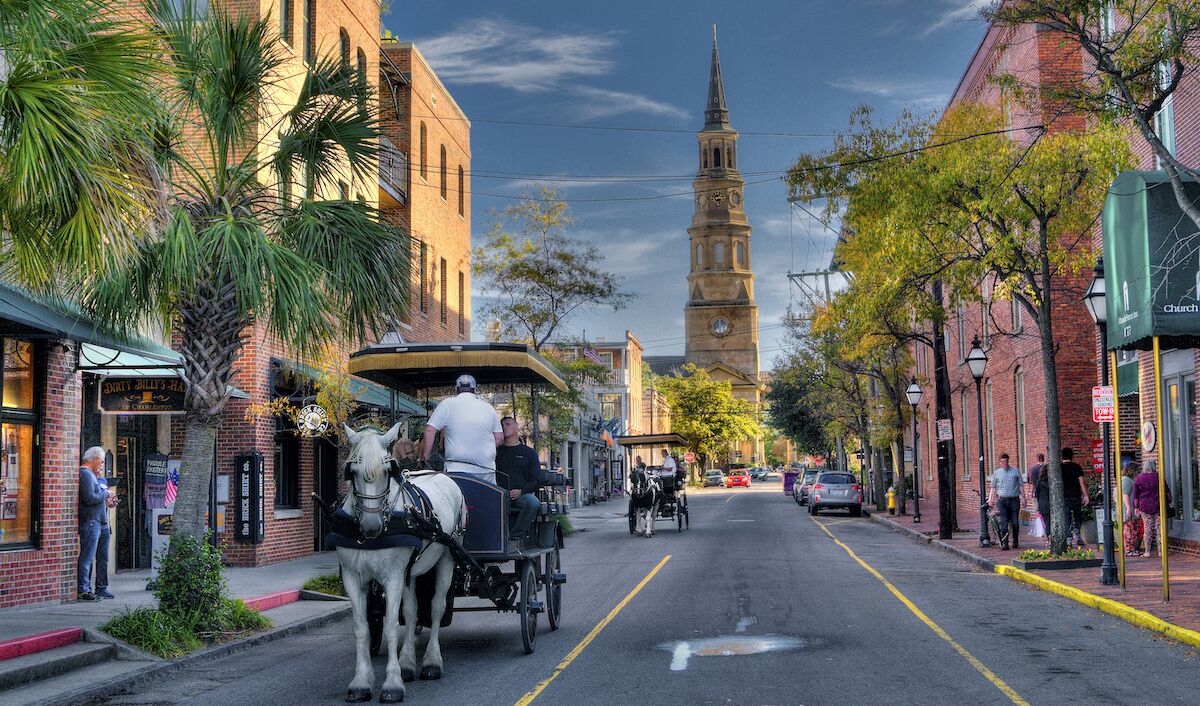 Horse-drawn carriage on a historic Charleston street